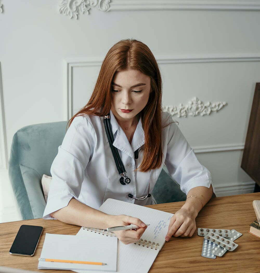 a woman sitting at a desk