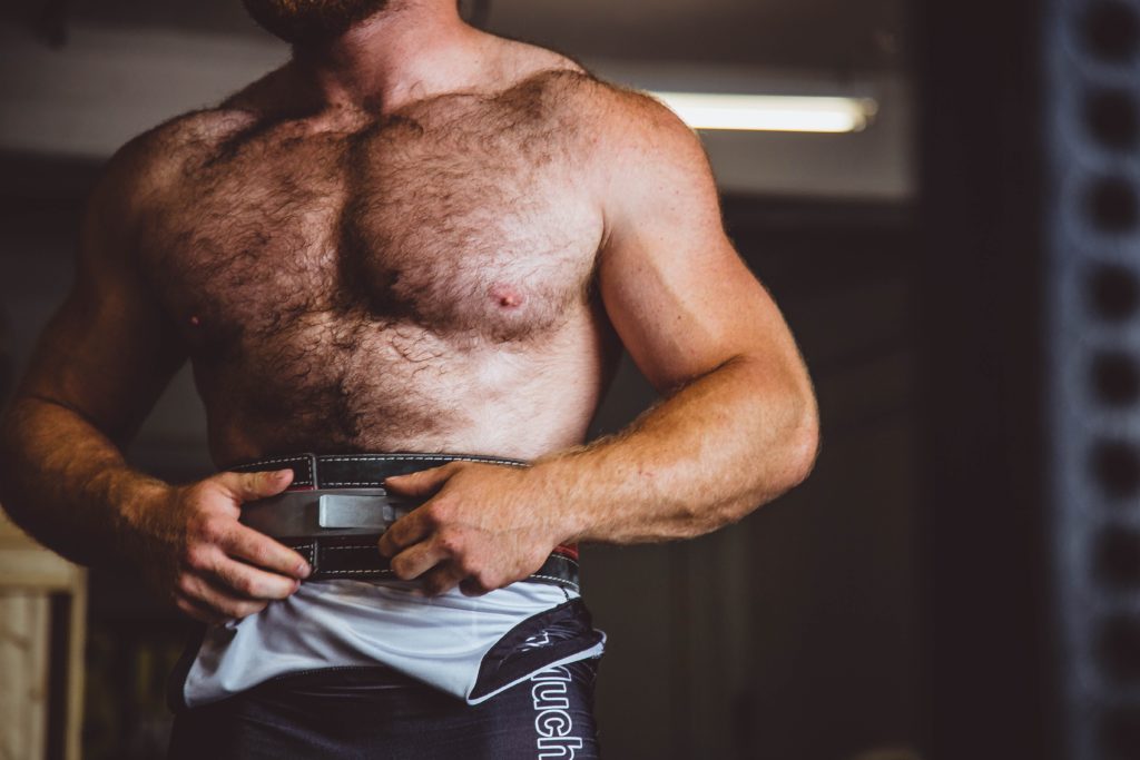 a man with a beard holding a camera