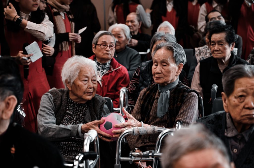 a group of people sitting in a crowd