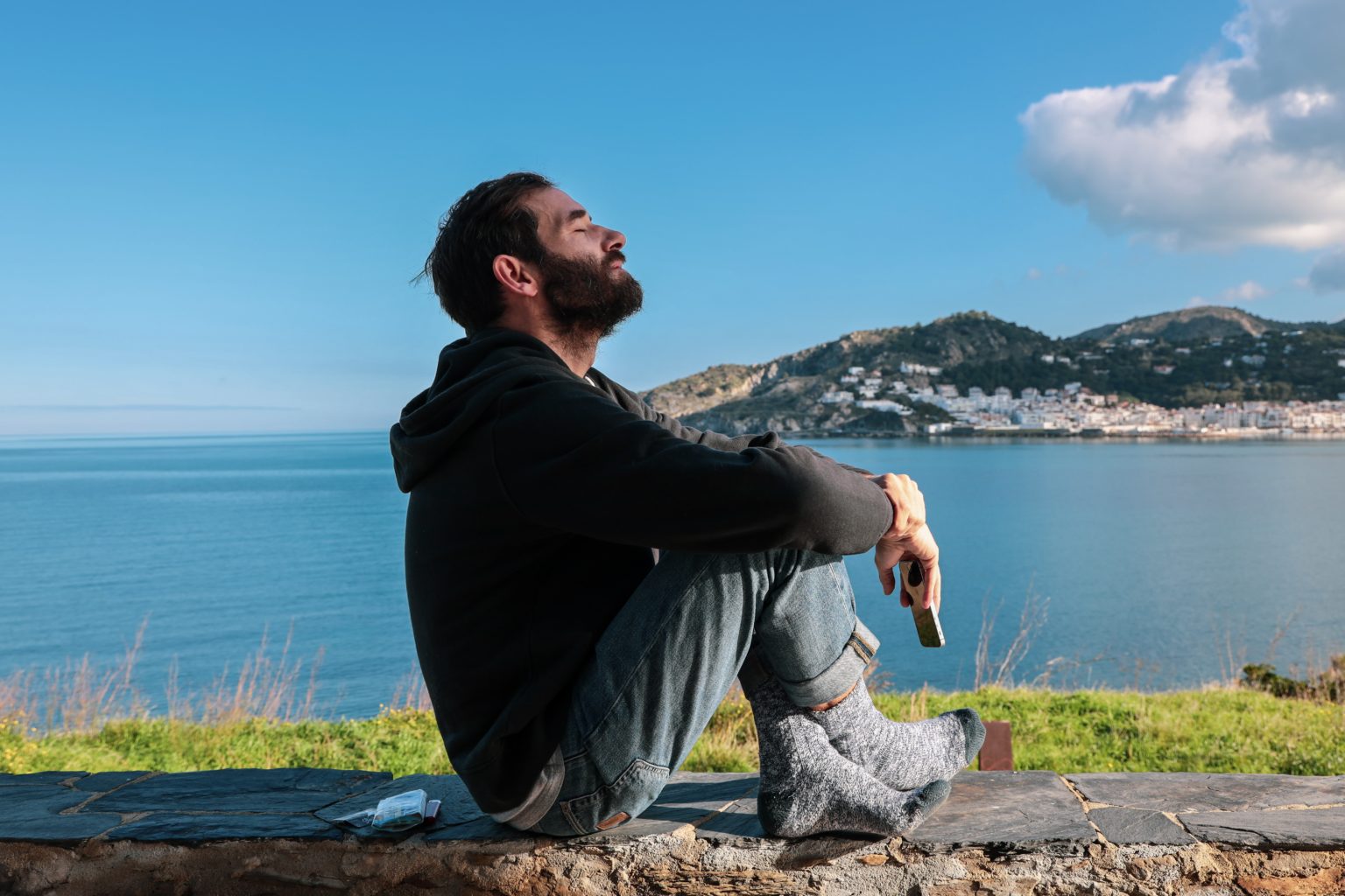 a man sitting on a rock