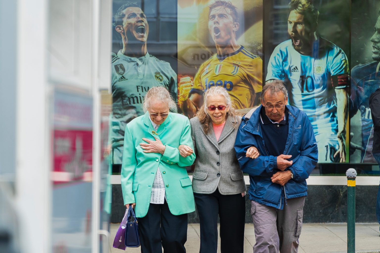 a group of people standing outside a store