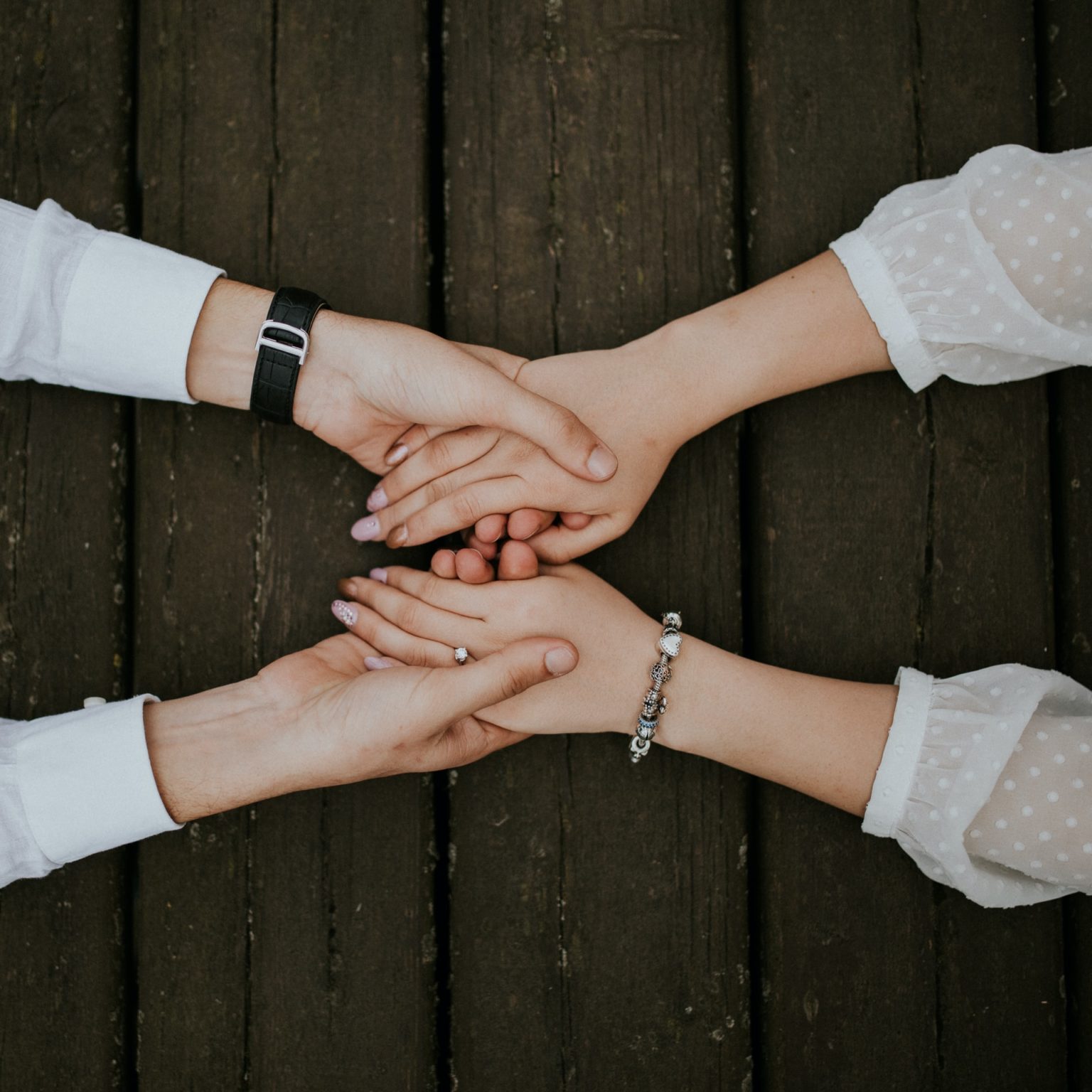 a group of hands shaking