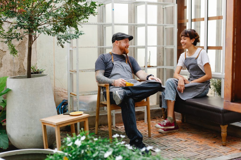 a man and a woman sitting on a bench