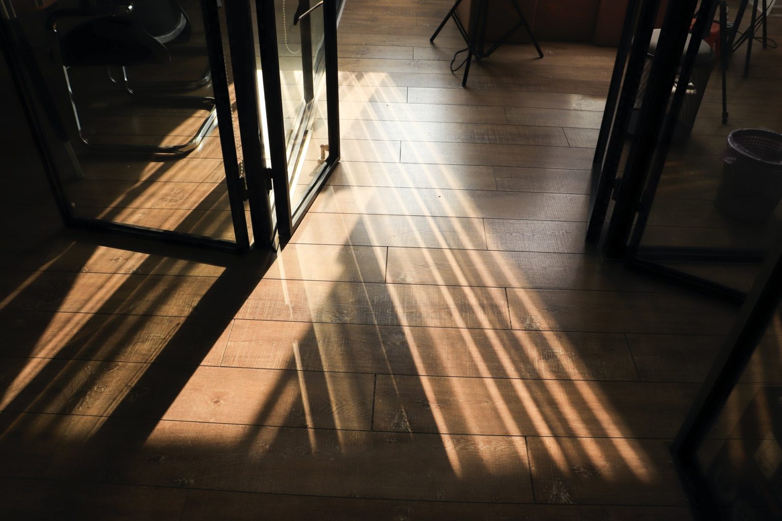 a wooden floor with a railing