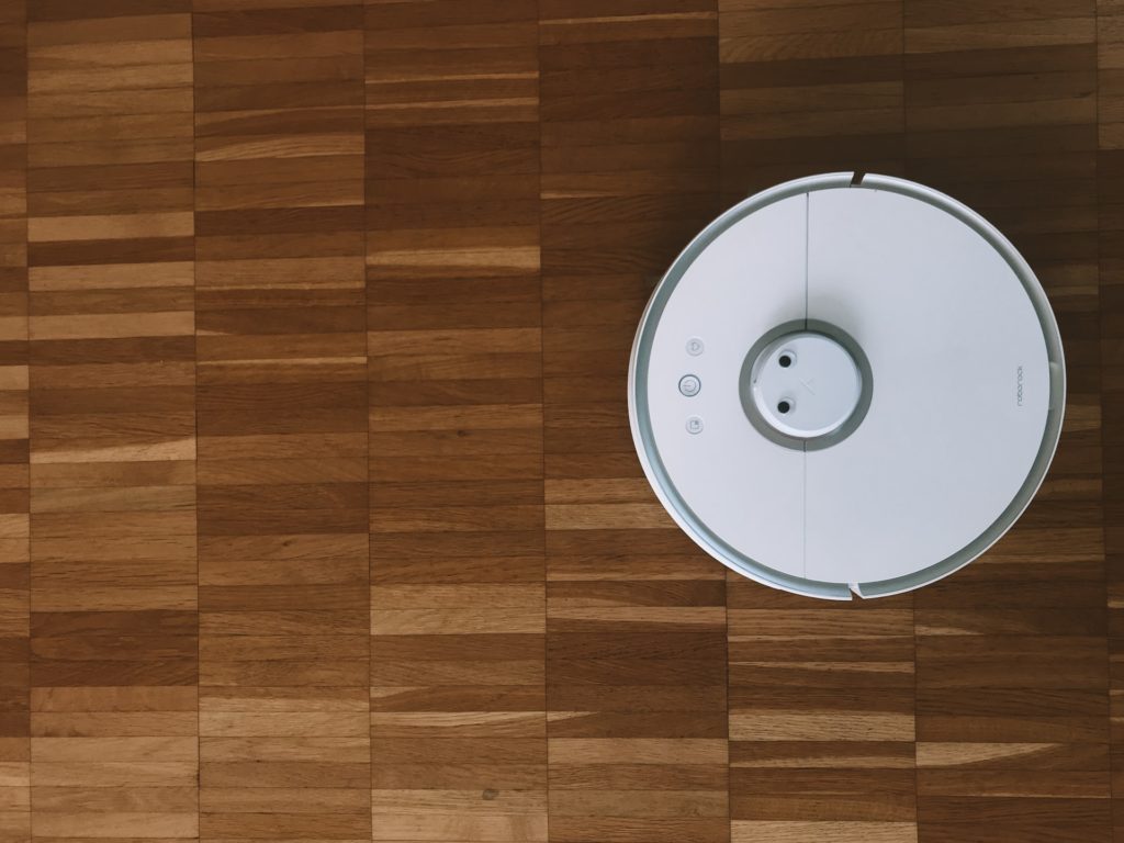 a white fan on a wooden surface