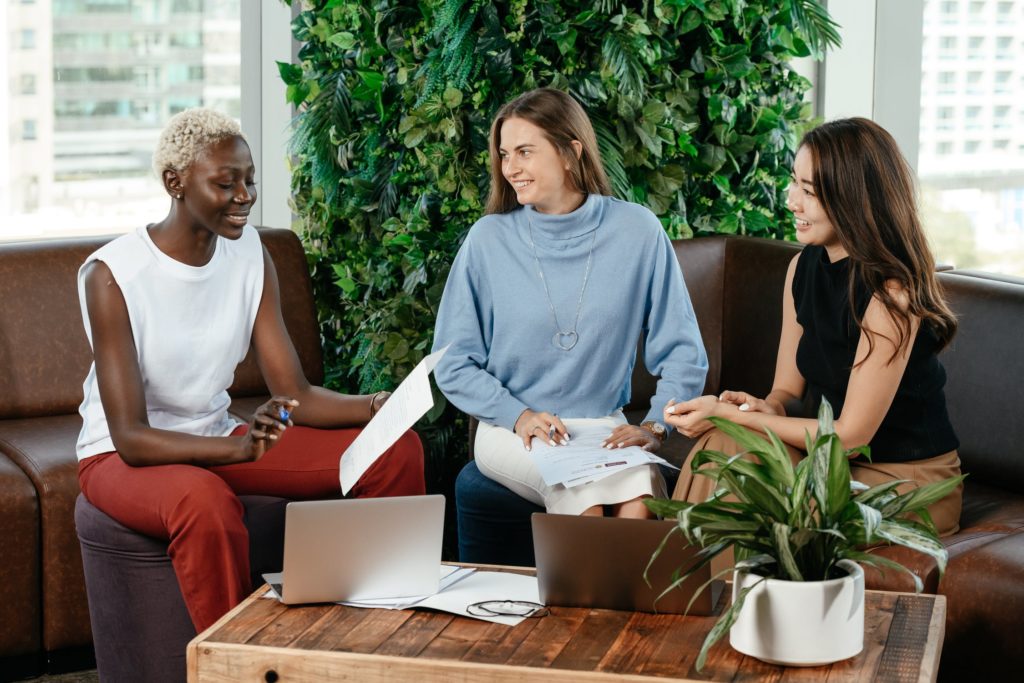 a group of people sitting around a table