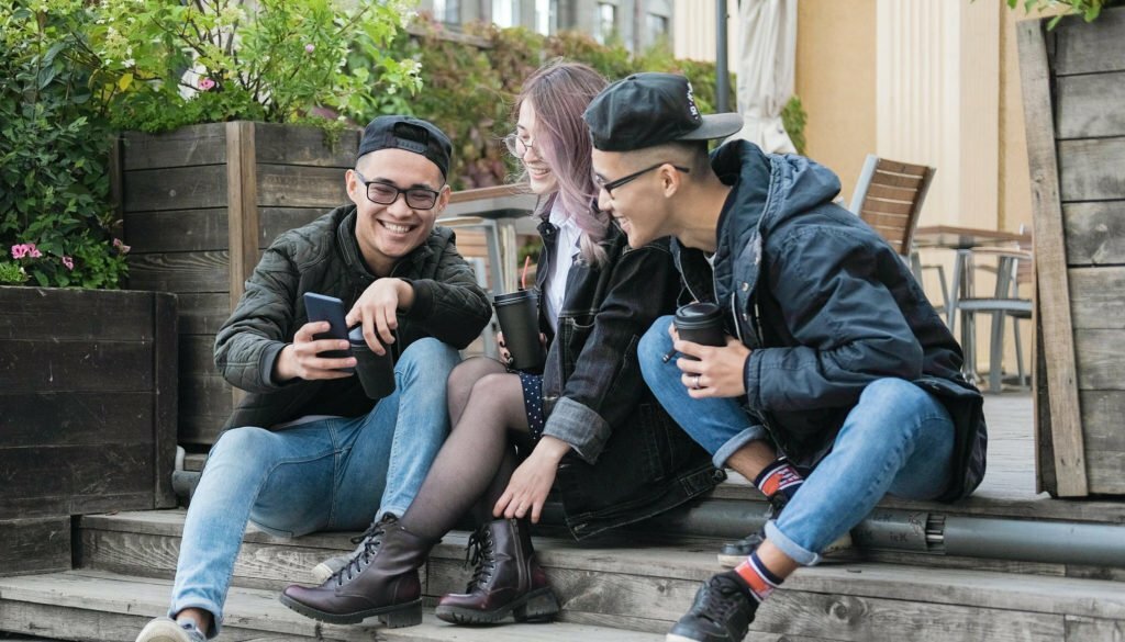 a group of people sitting on a bench