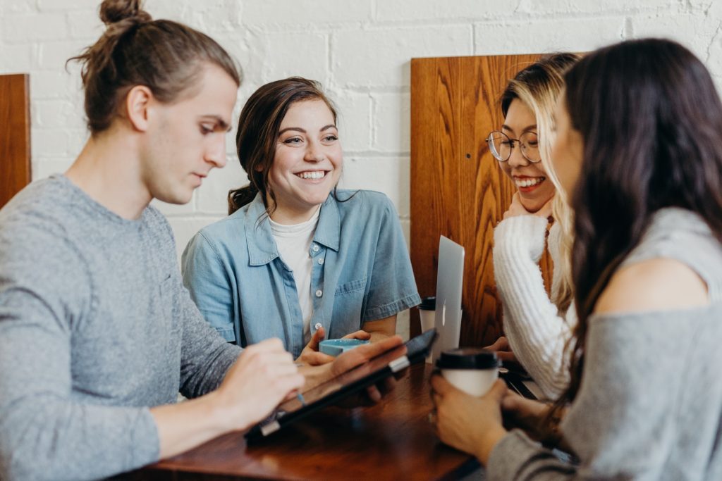 a group of people sitting around a table