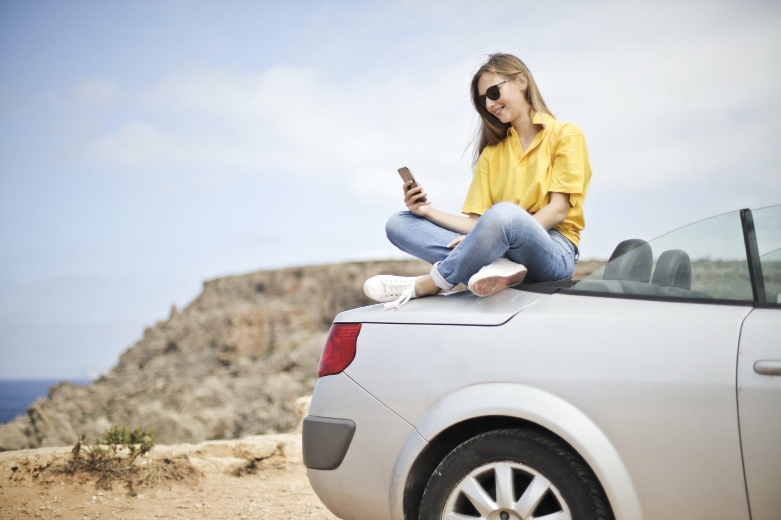 a person sitting on a car