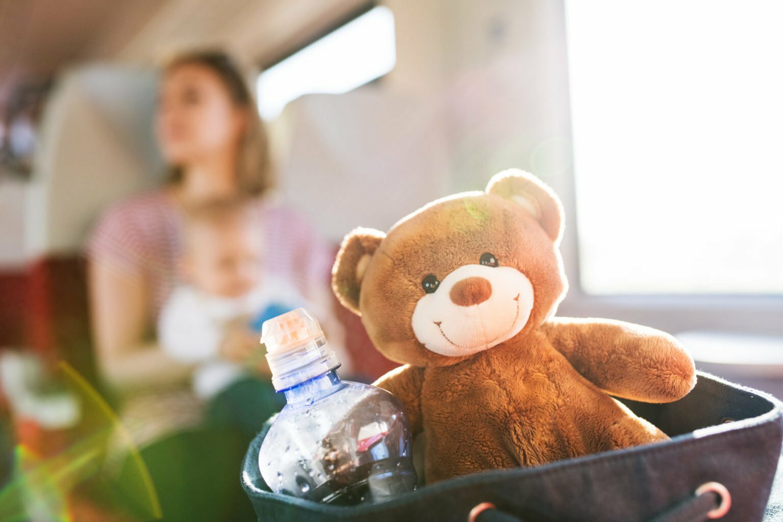 a teddy bear sits in a chair